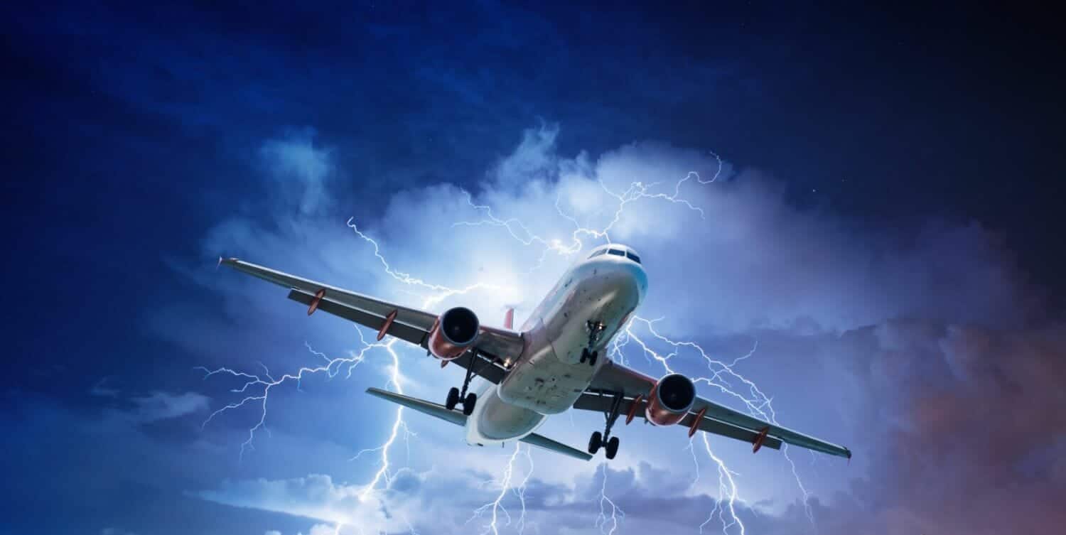 The image shows an aircraft flying directly into a powerful storm with lightning illuminating the dark clouds. This visually represents the challenges of meteorology in ATPL training, including thunderstorms, turbulence, and adverse weather conditions that pilots must navigate safely. It highlights the importance of weather awareness, flight planning, and decision-making in aviation.